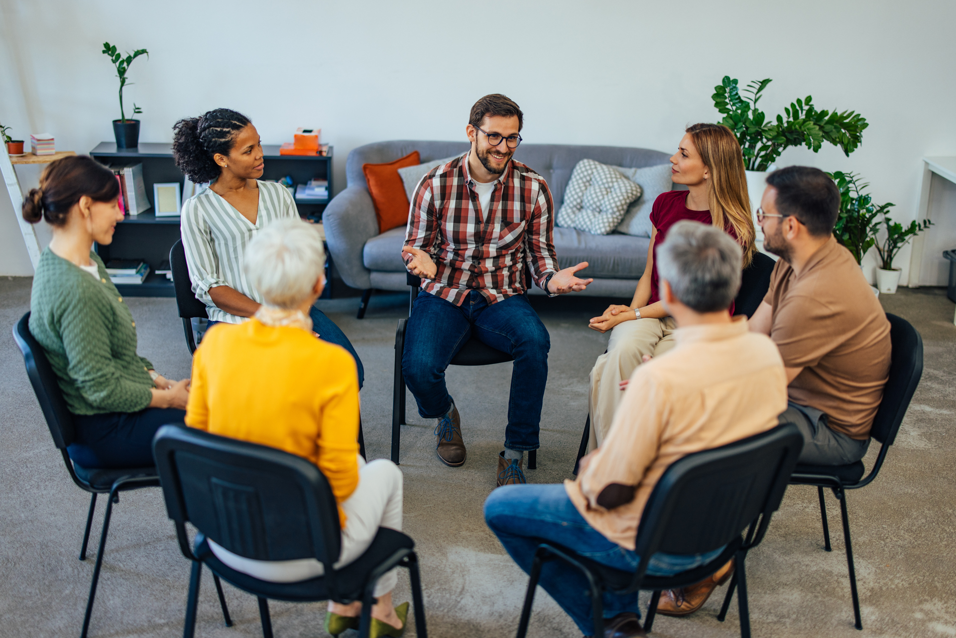 a-man-speaking-in-group-therapy